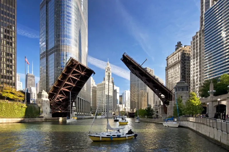 DuSable Bridge opening with a sailboat going under it