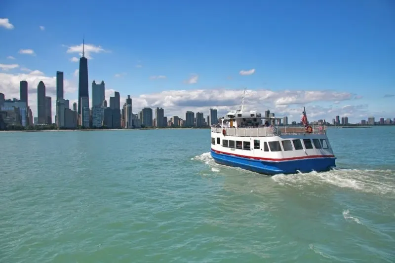 Boat cruising off the Lake Michigan shoreline in Chicago