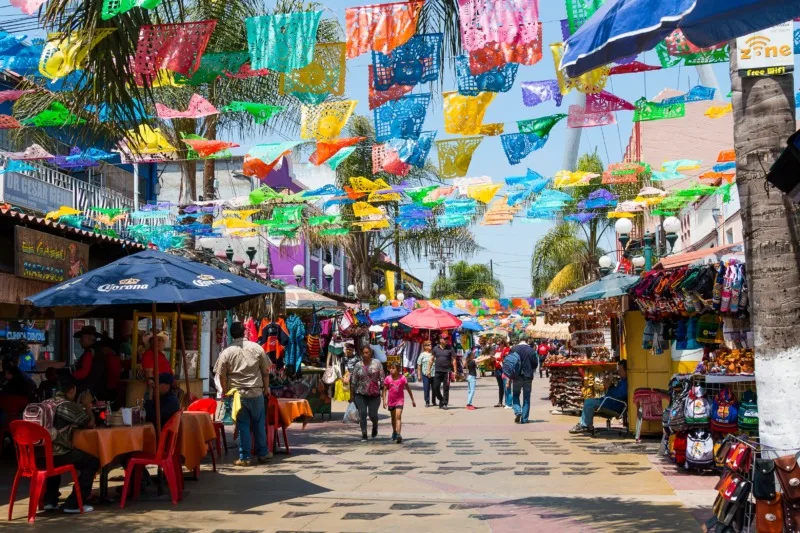 Colorful paper cut outs, papel picado, decorating Plaza Santa Cecilia in Tijuana